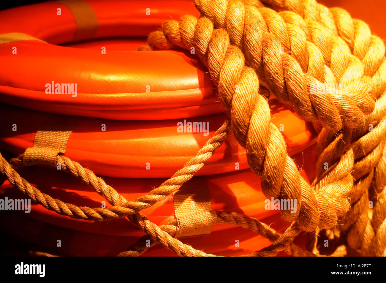 Orange life preserver and ropes Stock Photo - Alamy