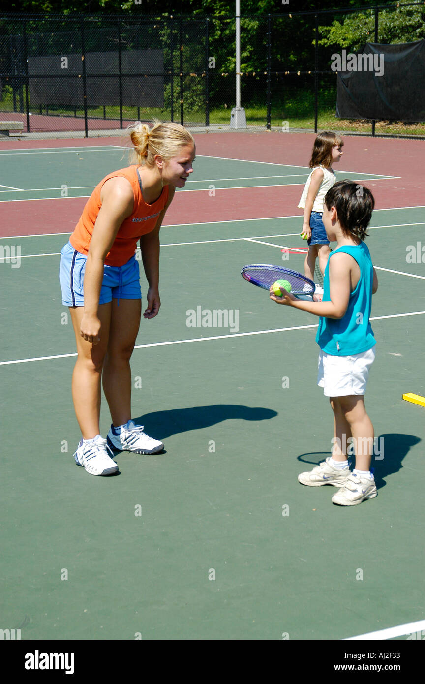 Kids Learn to Play Tennis at Public Recreation Court Stock Photo Alamy