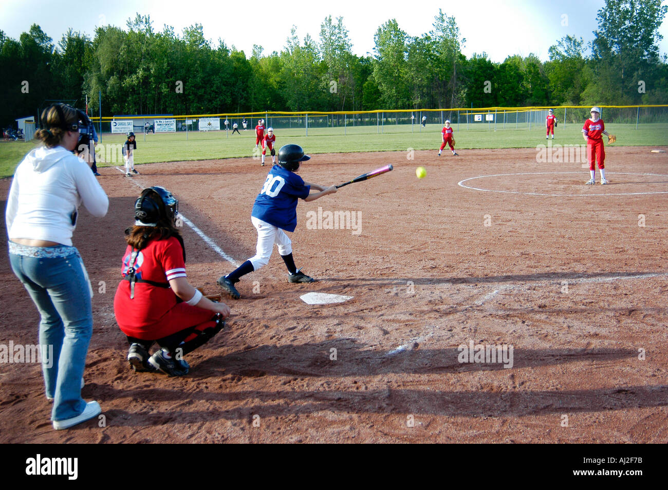 Middle School Girls Play Softball Stock Photo