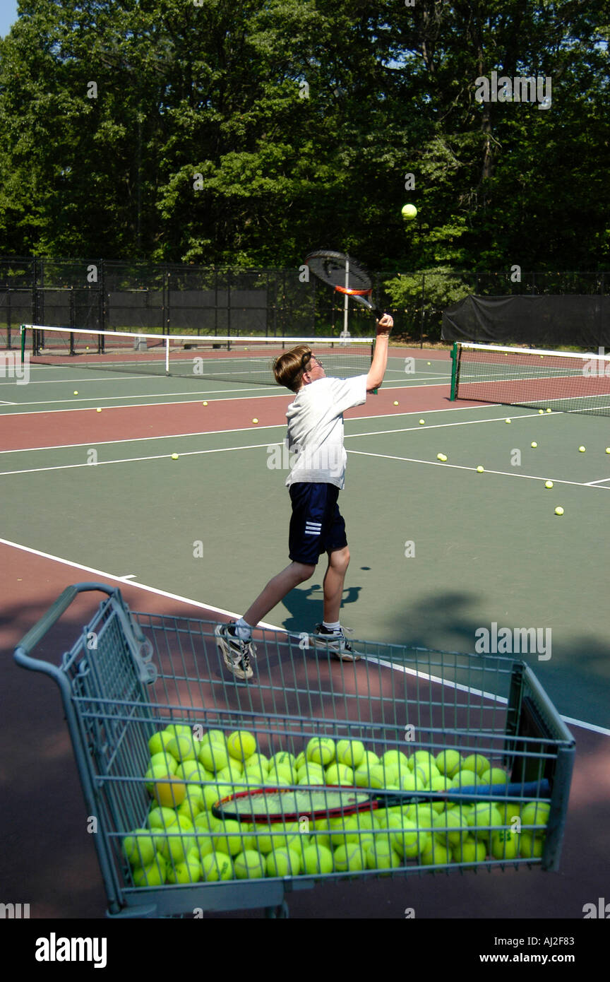 Kids Learn to Play Tennis at Public Recreation Court Stock Photo Alamy