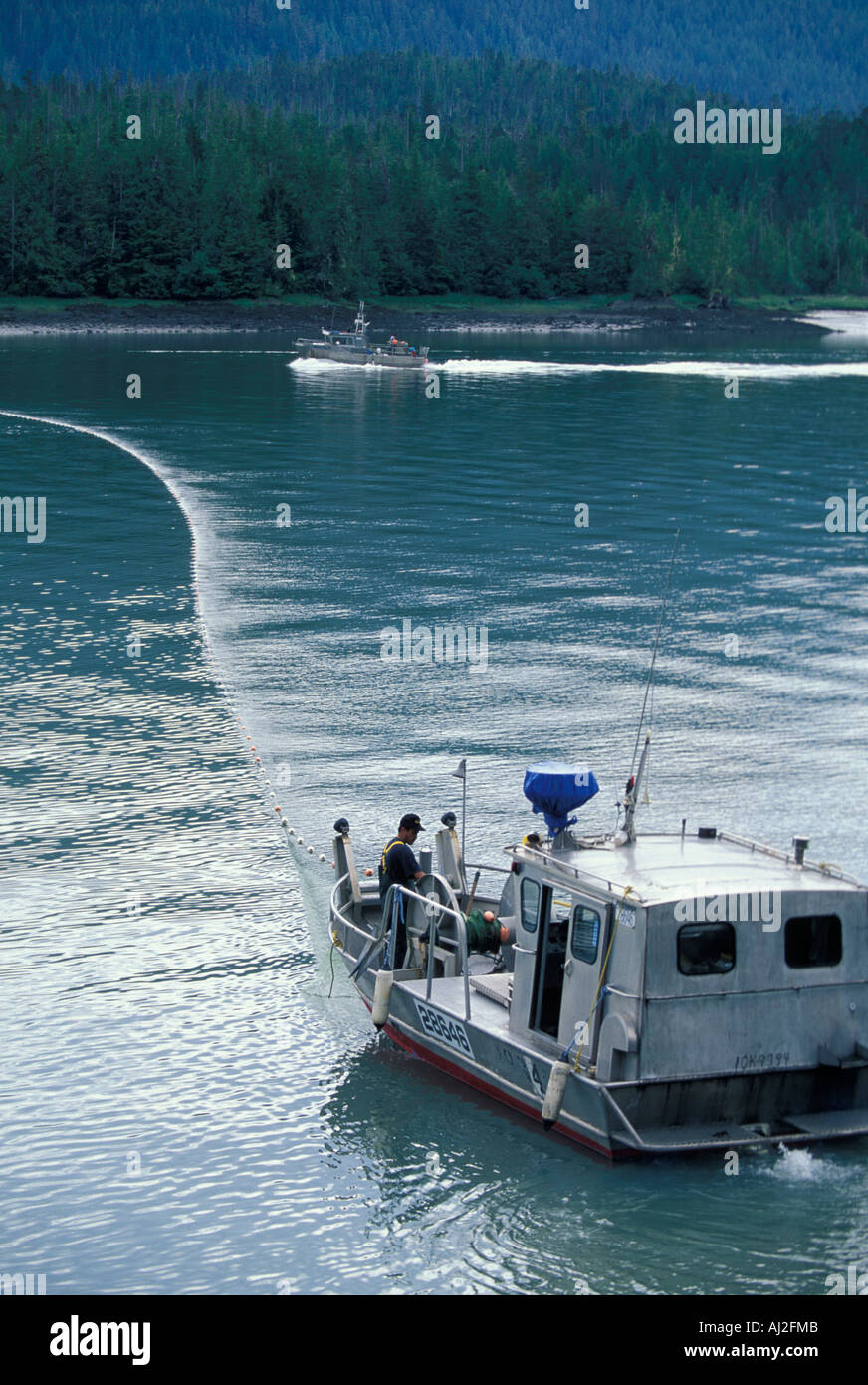 Canada British Columbia Fishing boat sets gill nets for spawning salmon
