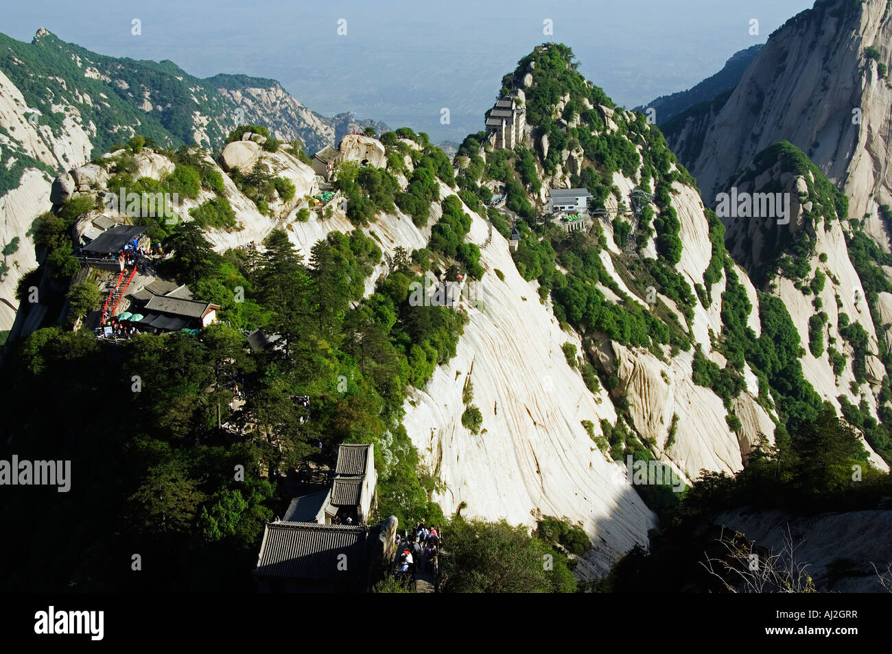 Hikers on a trail on Mount Hua, a granite peaked mountain (2160m) in the Shaanxi Province, China Stock Photo