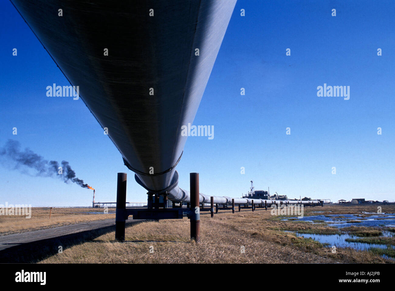 USA Alaska Prudhoe Bay Gas flare and black smoke billow arctic tundra