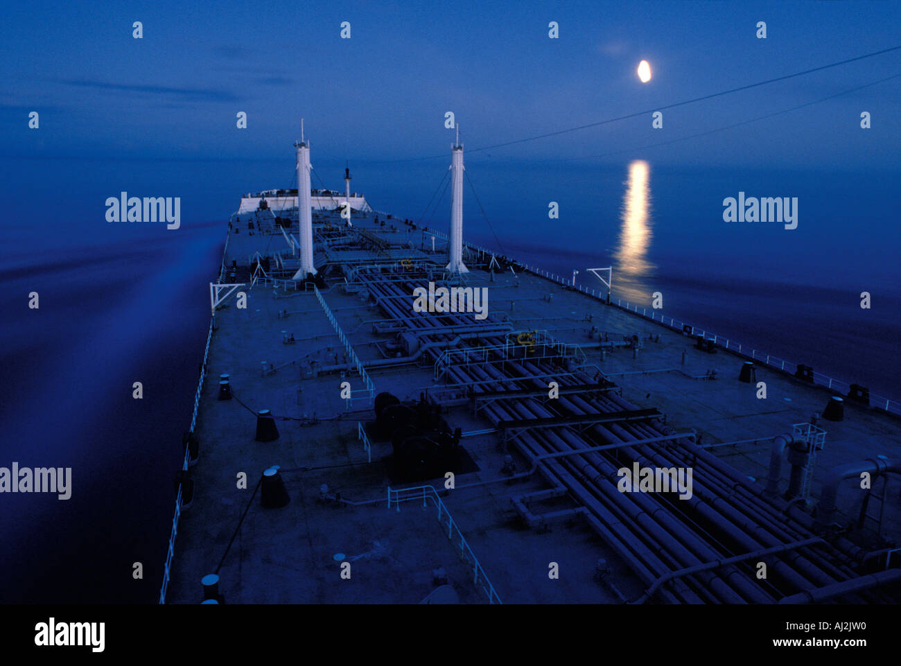 USA Alaska Oil tanker Arco Juneau sails off coast of southeast Alaska past rising full moon