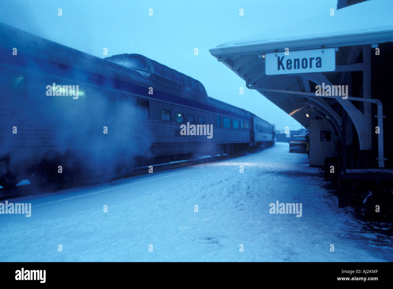 Canada Ontario VIA Rail passenger train in snowstorm at station in Kenora Stock Photo