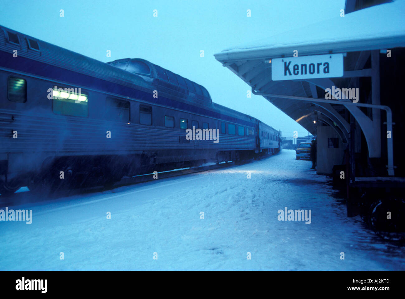Canada Ontario Kenora VIA Rail passenger train in snowstorm at train station in western Ontario Stock Photo