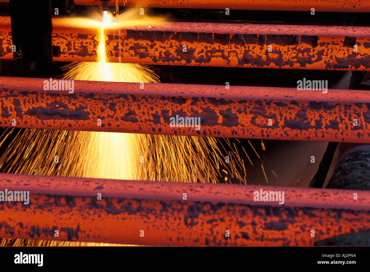 USA Washington Seattle Sparks fly from acetylene torch cutting bars of