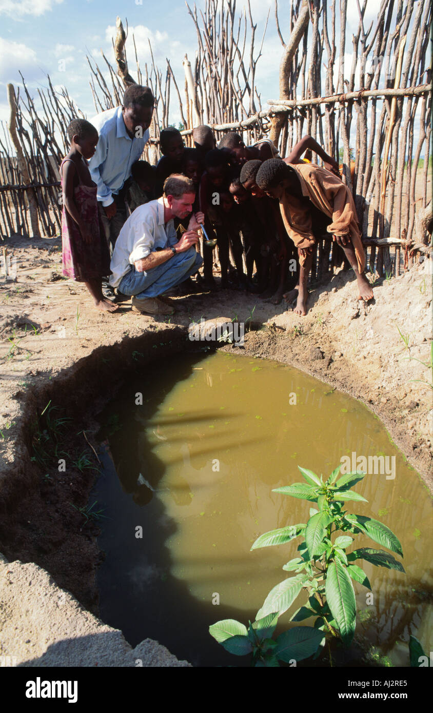Children learning about the life cycle of mosquitoes and the dangers of malaria to raise awareness. Binga, Zimbabwe Stock Photo