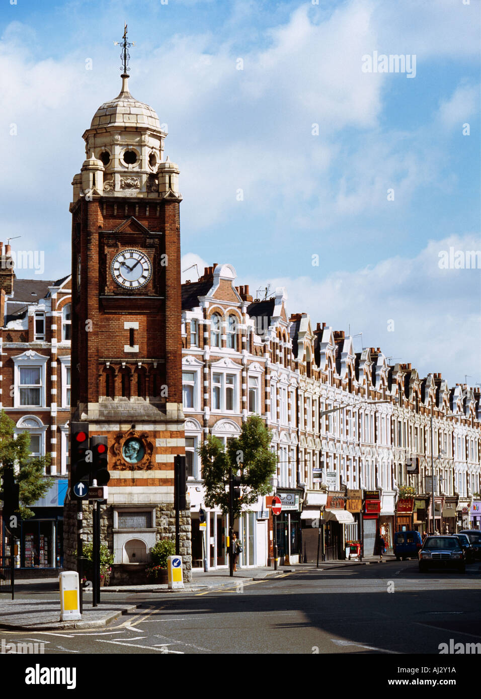 Victorian Clock Tower and Shopping parade in north London suburb UK