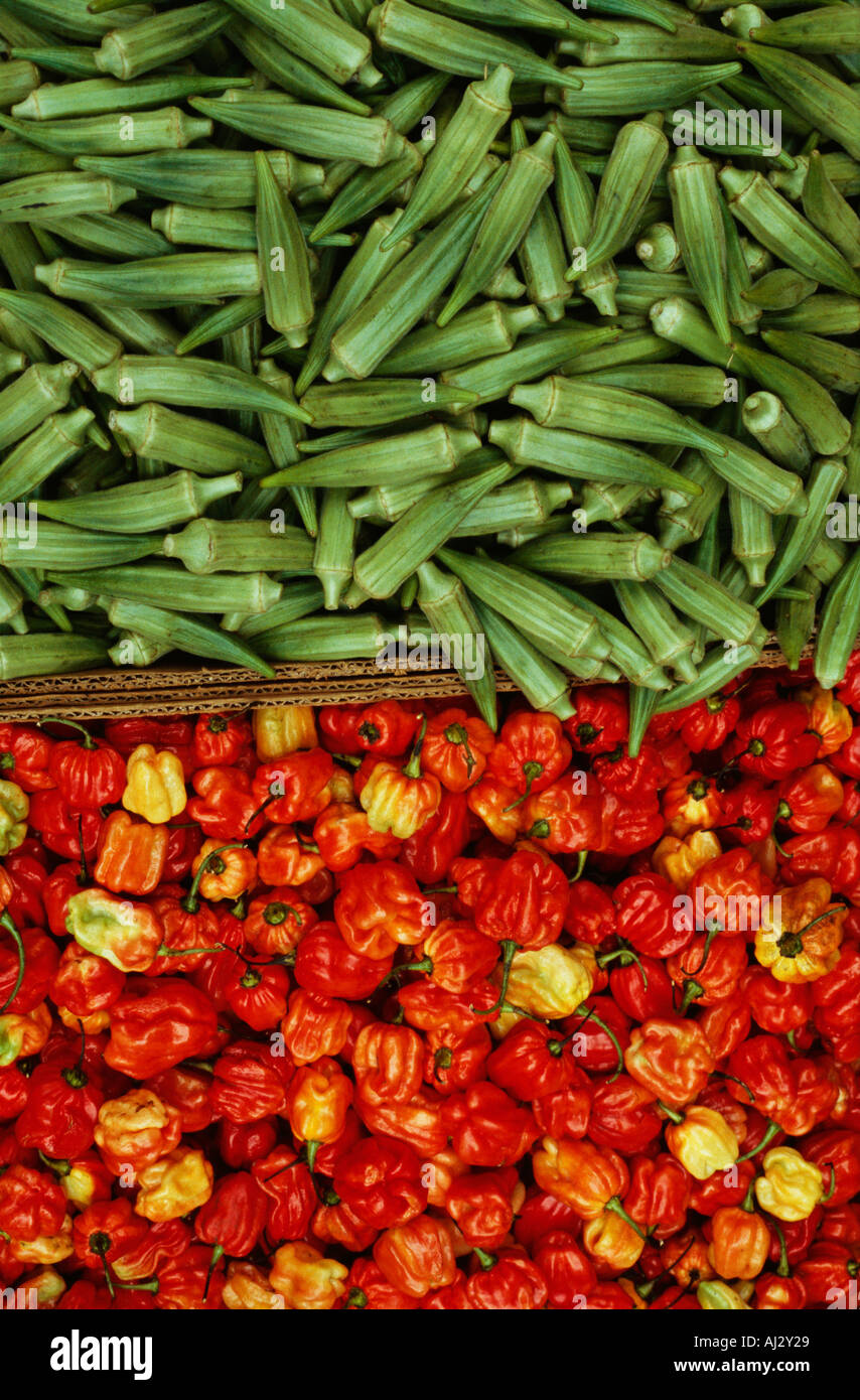 Okra and red chillie peppers on market stall London UK Stock Photo