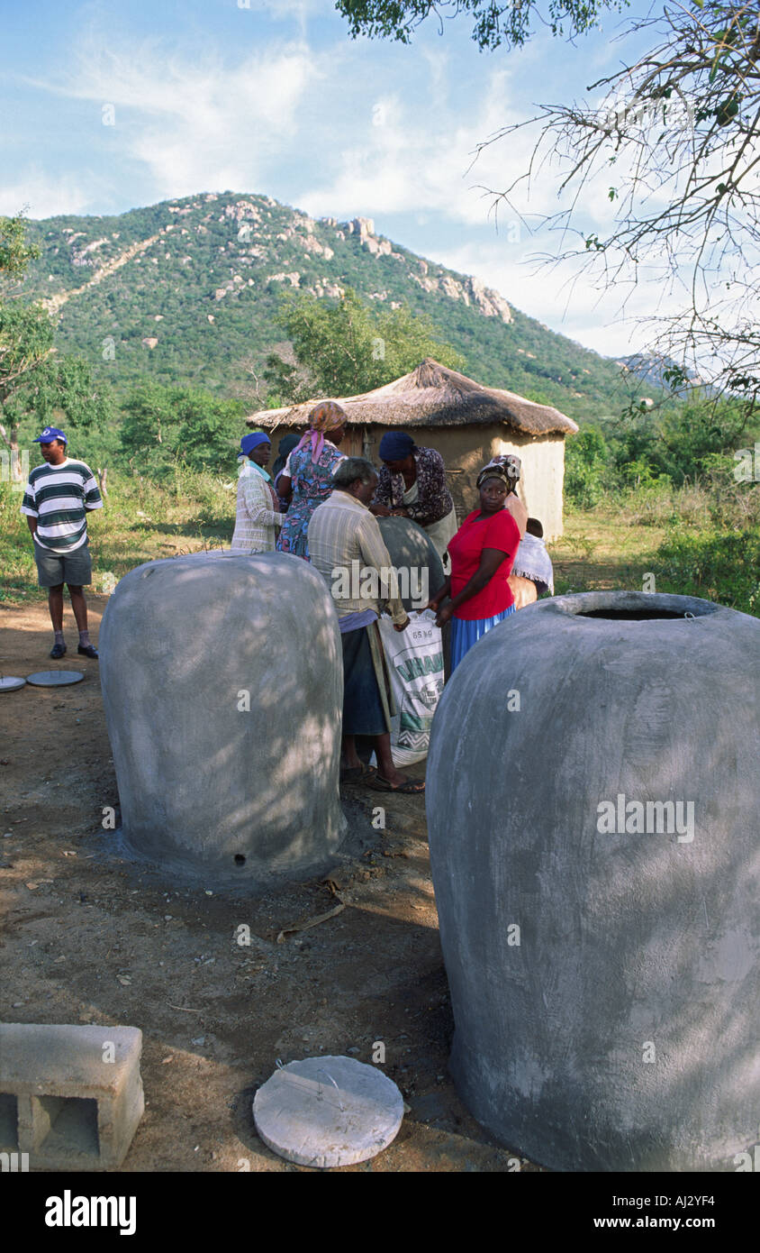Large concrete water pots storing clean drinking water for schoolchildren at a new school in rural Eswatini (Swaziland) Stock Photo