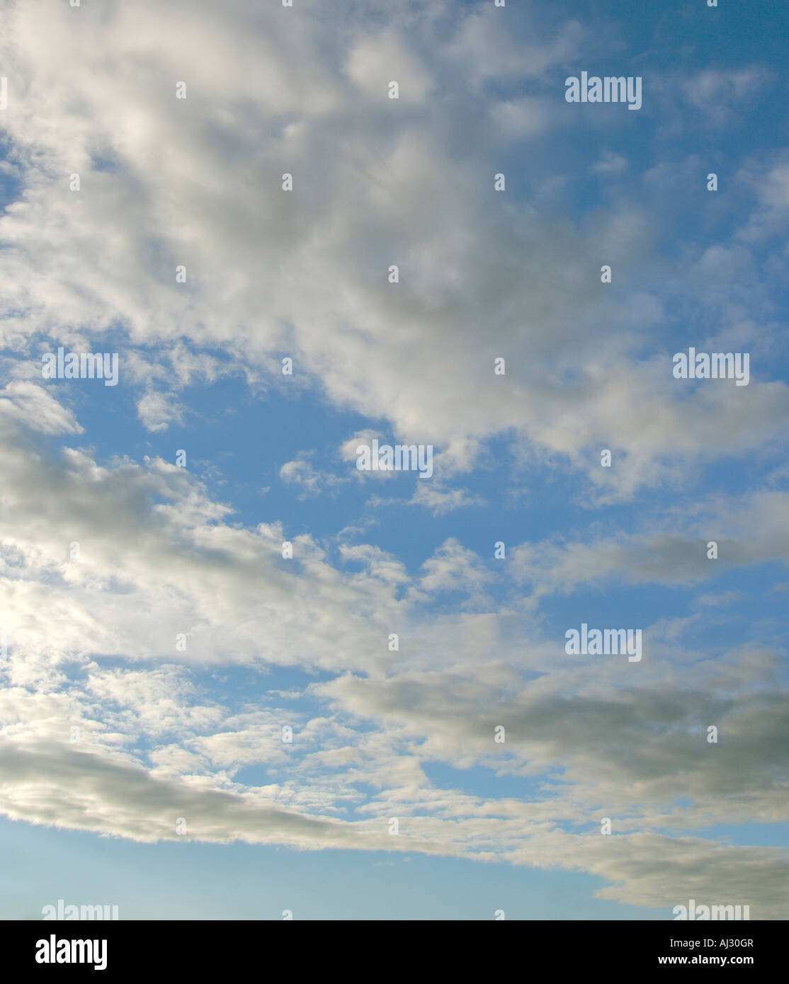 Blue sky with white clouds background image Stock Photo - Alamy
