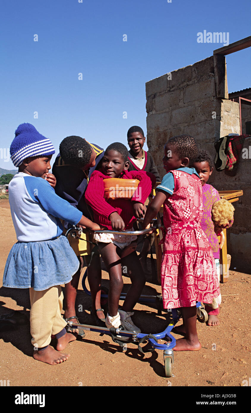 Disabled young girl at home with friends and family. Eswatini (Swaziland) Stock Photo