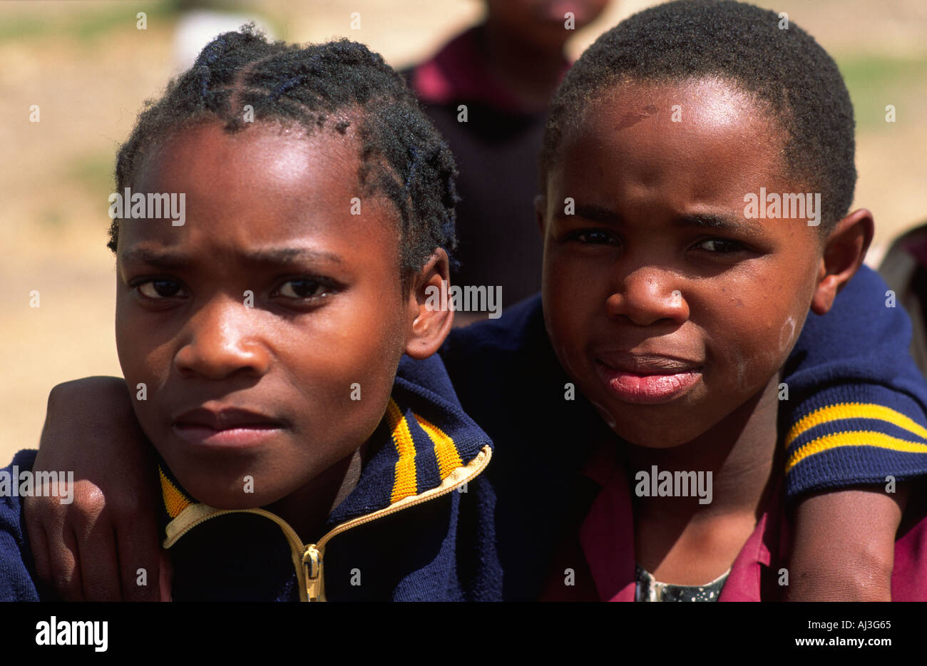 Landscape portrait of two schoolgirl friends. Lesotho Stock Photo