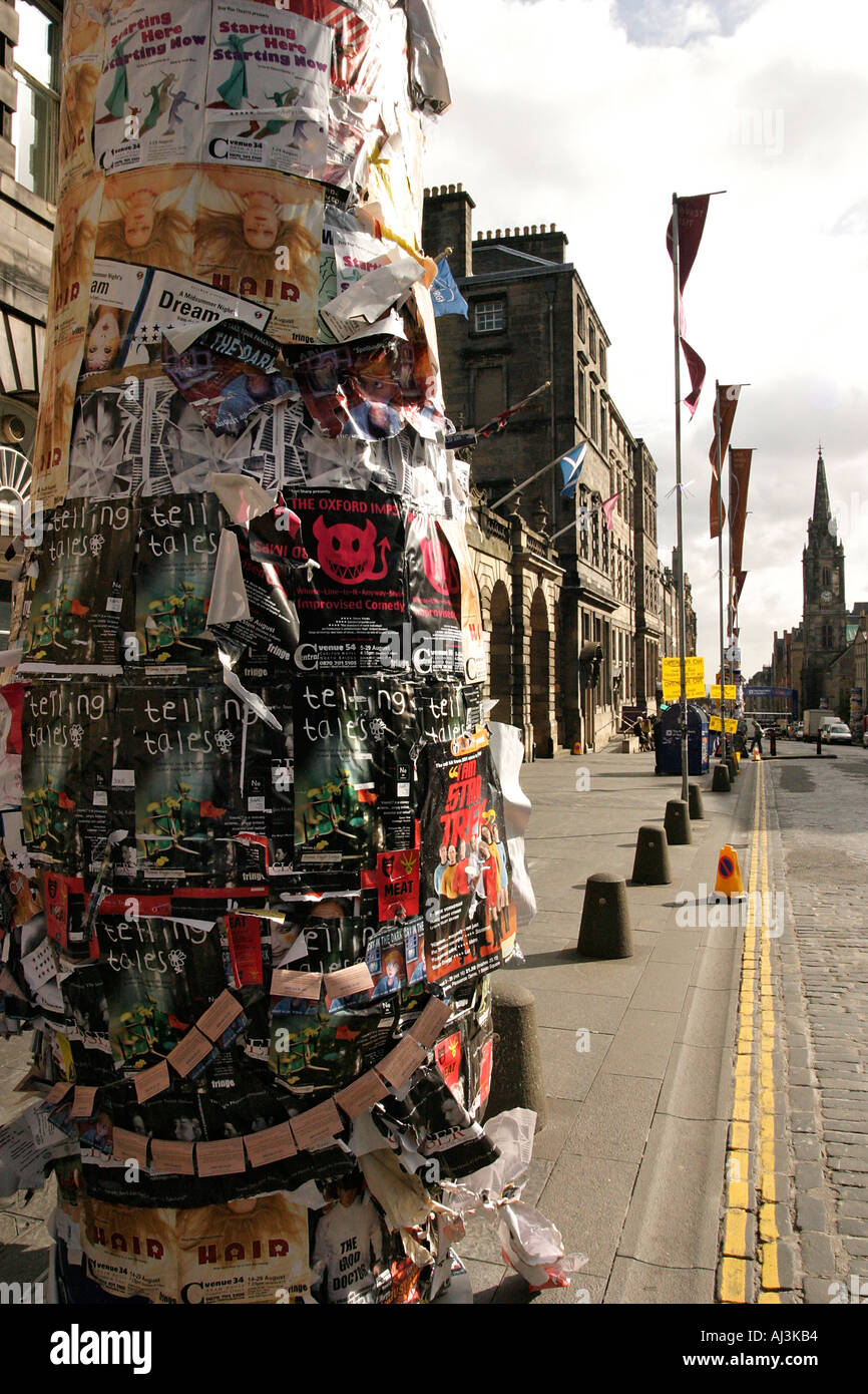 Edinburgh Fringe Promotional posters on a lamp post on Princes street