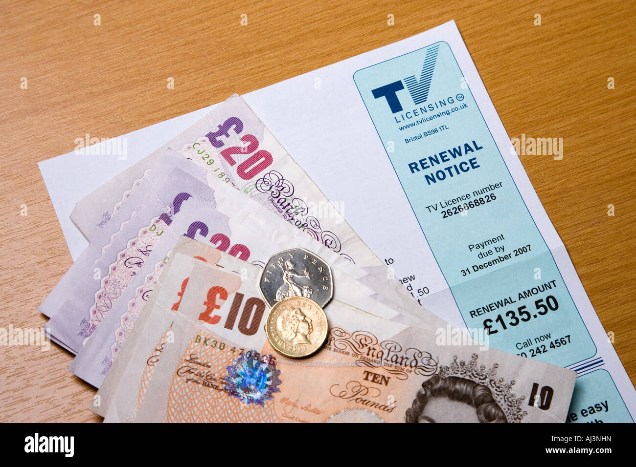 A television licence application form with cash to pay for it Stock Photo