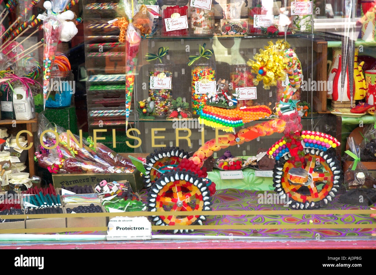 A childs tricycle made entirely of sweets in a shop window Stock Photo