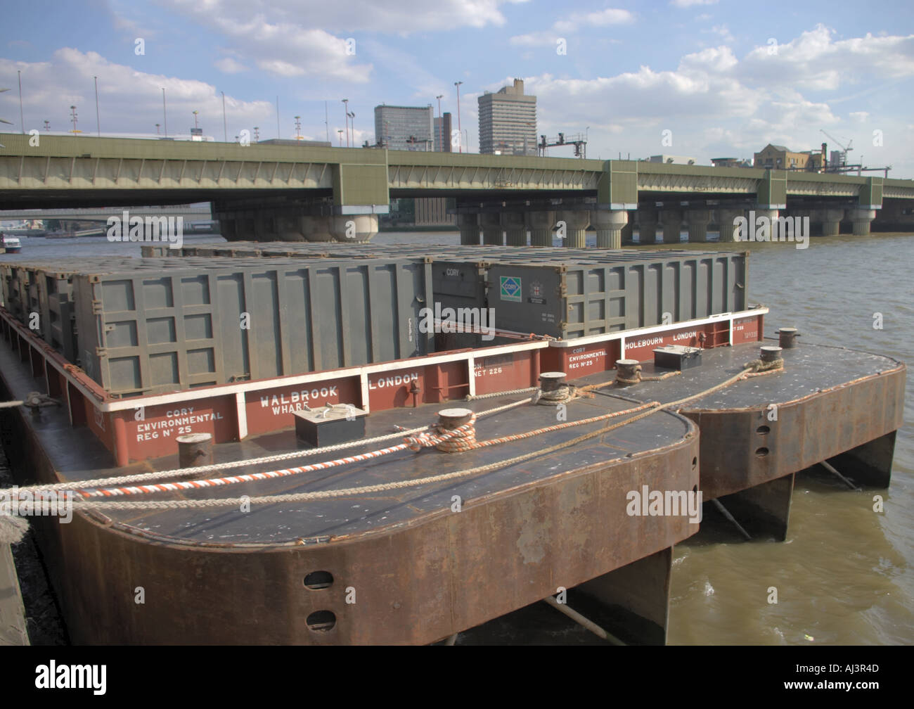 Barges for commercial waste from the City of London on the River Thames near Southwark Bridge