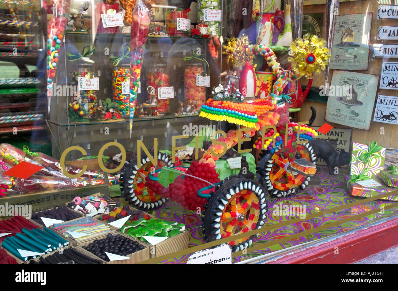 A childs tricycle made entirely of sweets in a shop window Stock Photo