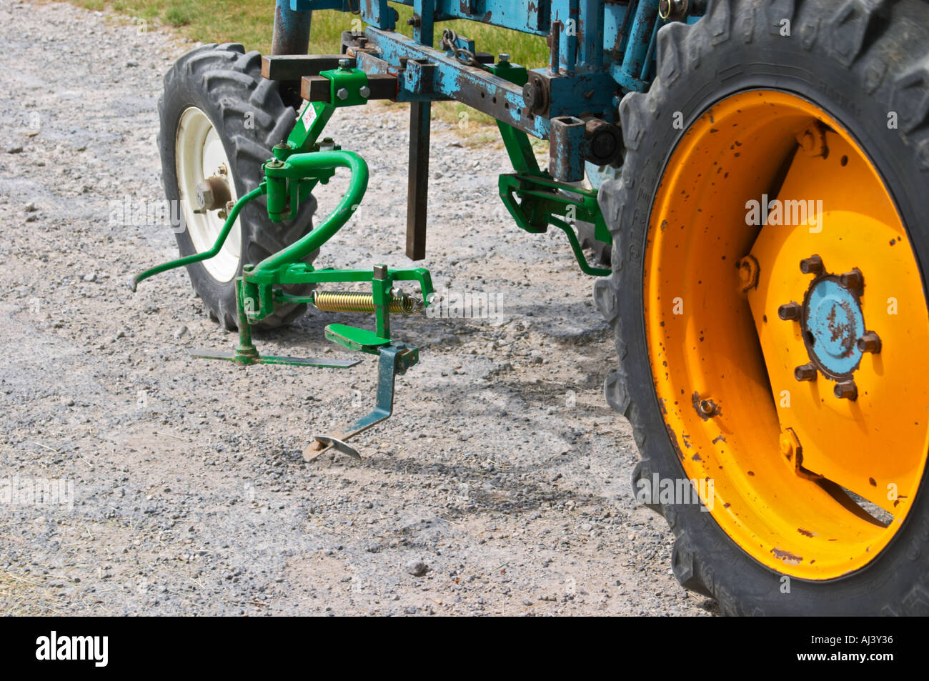 A vineyard tractor equipped with knifes to mechanically cut off remove
