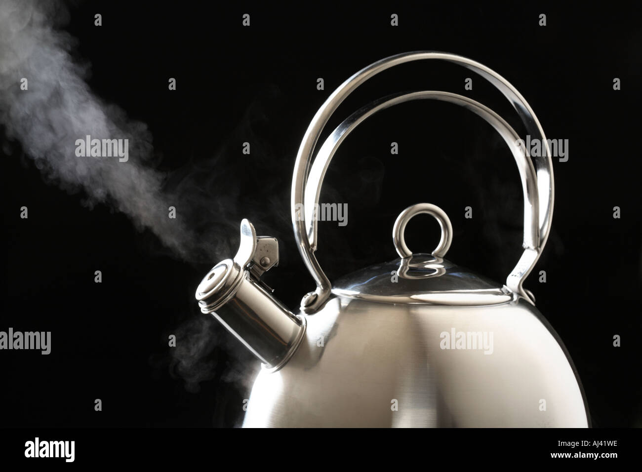 Kettle boiling with steam Stock Photo