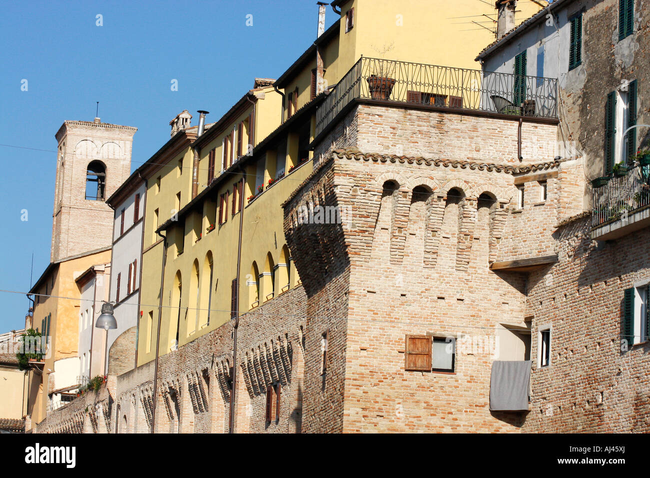 Houses are built on top of the historic wall around the medieval town