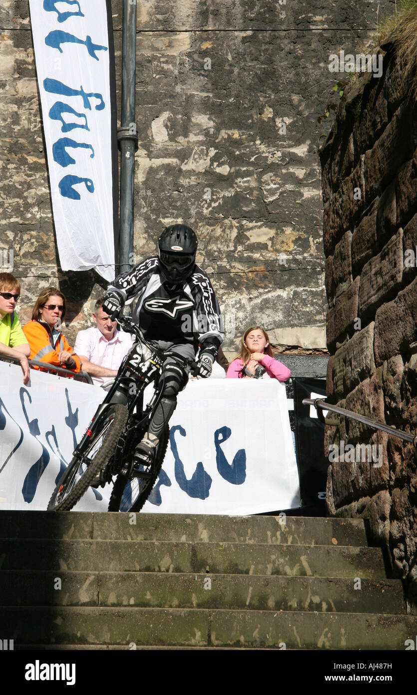 Competitor practising for the Fat Face Urban Night ride in Edinburgh mountain bike competition