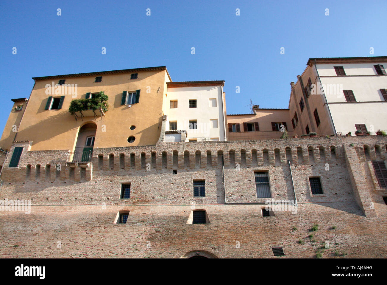 Houses are built on top of the historic wall around the medieval town