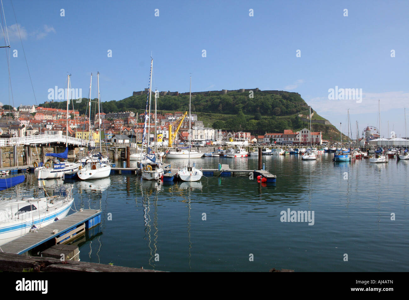 Scarborough harbour and castle pictured in the resort of Scarborough in North Yorkshire in England. Stock Photo