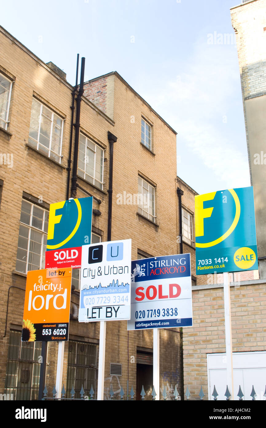 Estate agents for sale boards in Shoreditch London Stock Photo Alamy