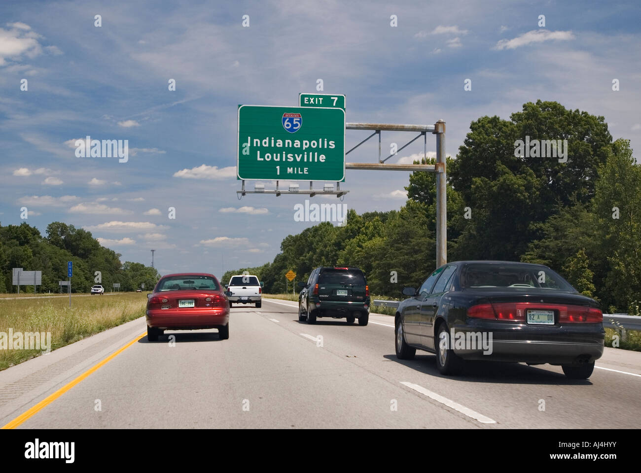 Exit Sign and Traffic on 265 Connecting Interstate Highway 64 to Interstate Highway 65 Clark County Indiana Stock Photo