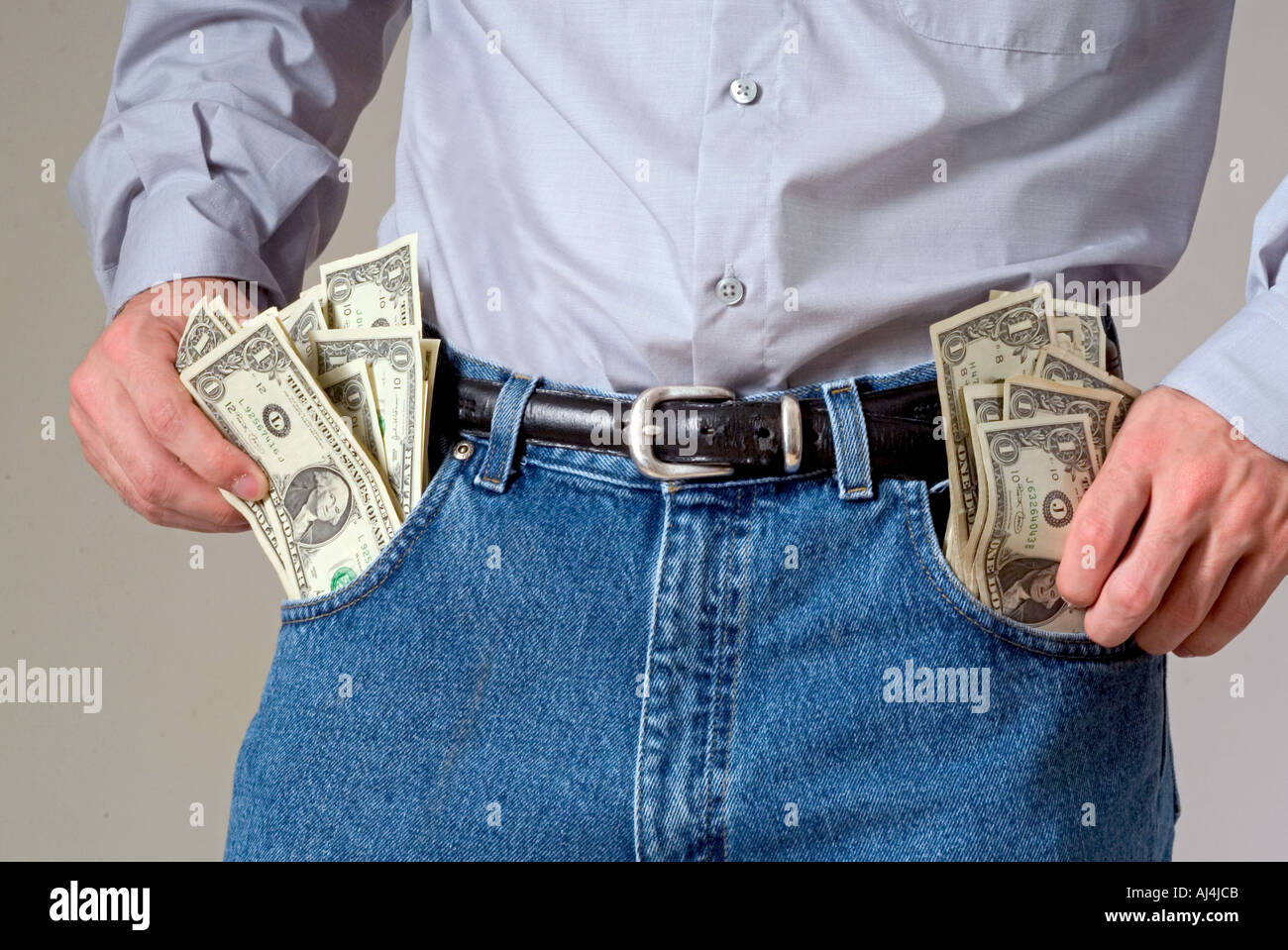 Man Flush with Cash Stock Photo Alamy