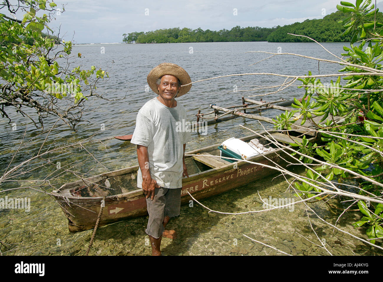 Local native man 62 years old stands in tropical jungle and talks about traditional uses of mangrove plants in Micronesia Stock Photo