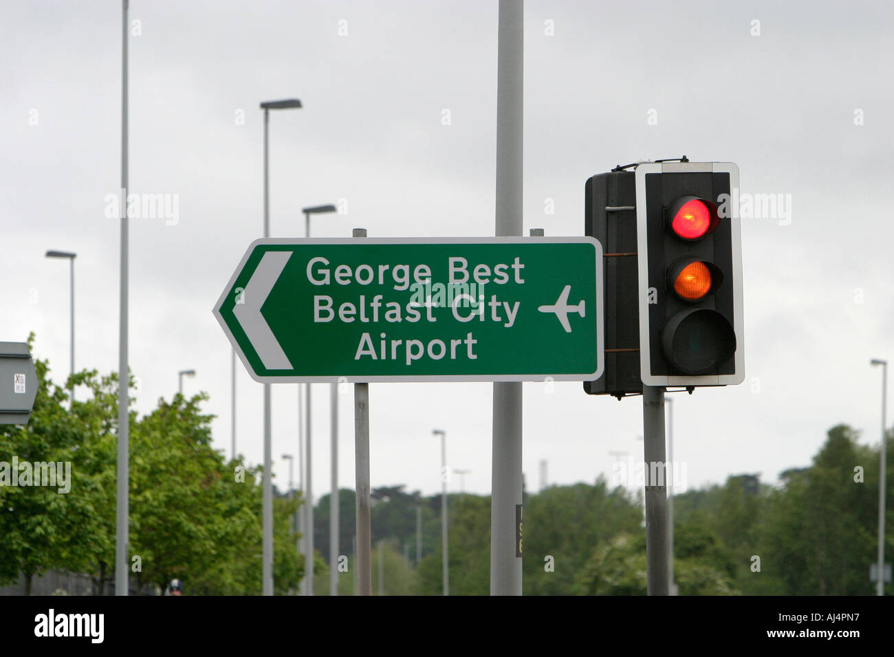 roadsign and traffic lights outside best belfast city airport northern ireland Stock