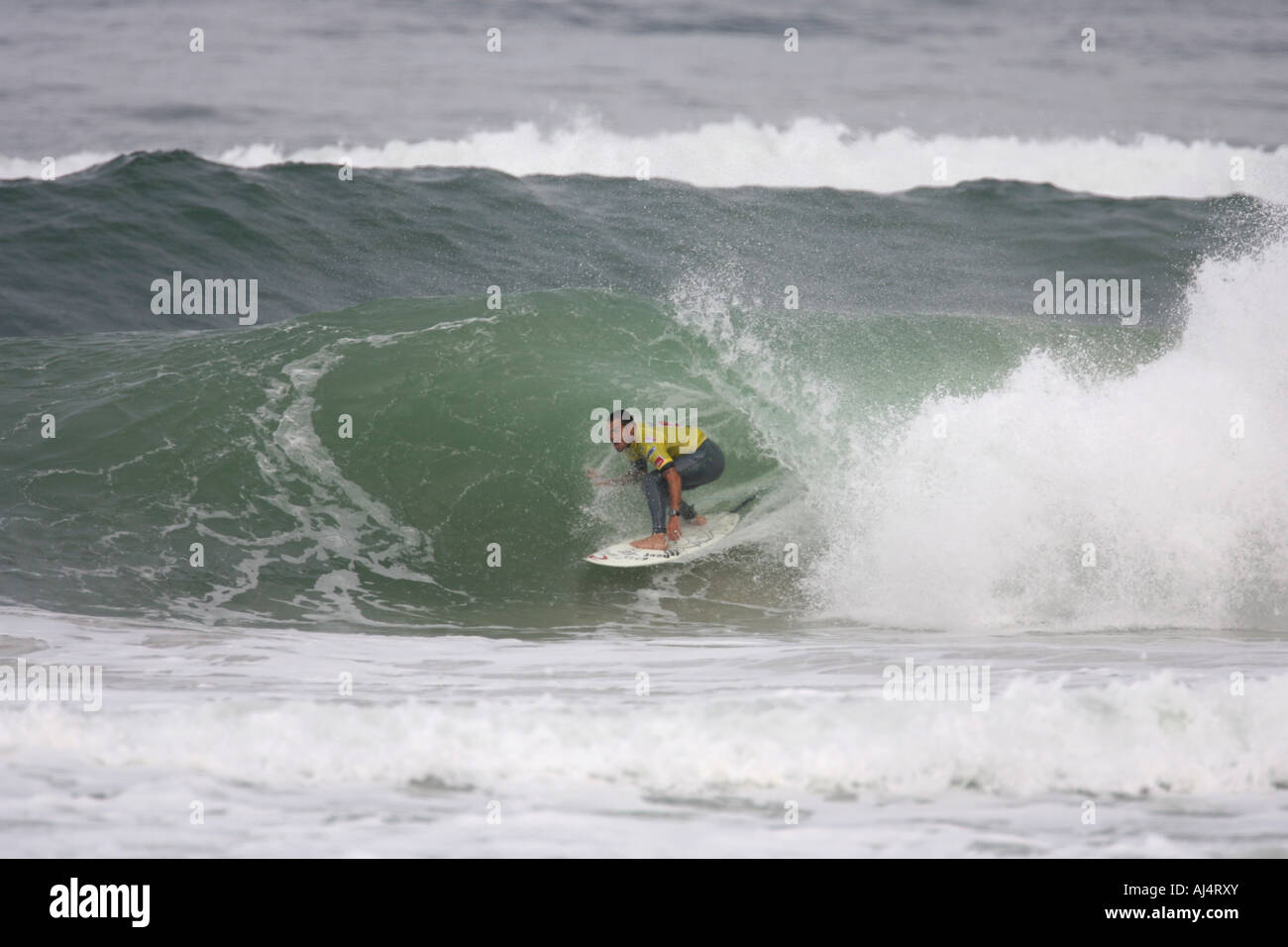 A Surfer rides a Wave Stock Photo - Alamy