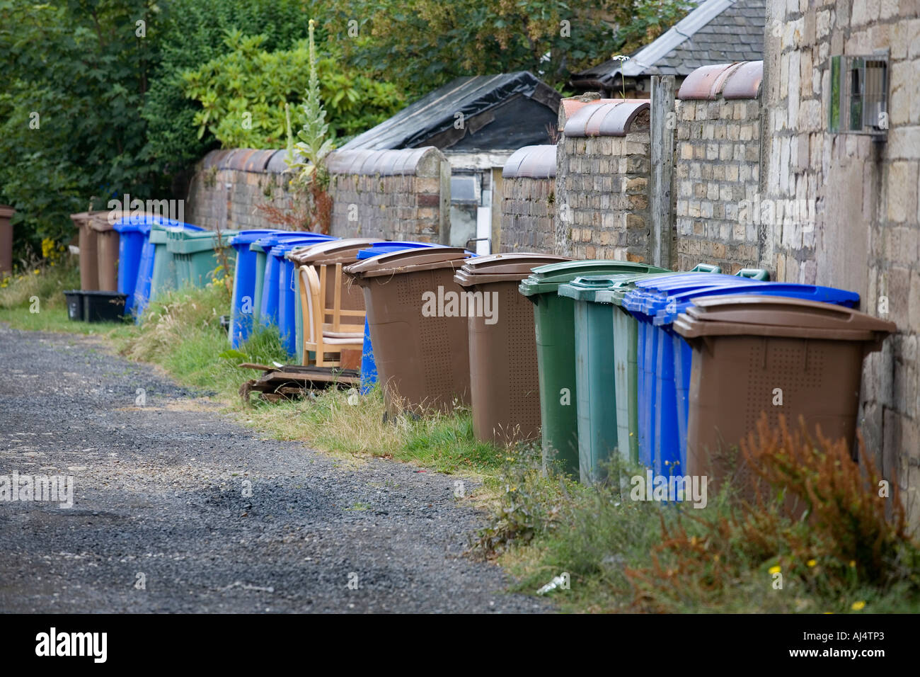 Green blue and brown plastic wheelie bins used for recycling household