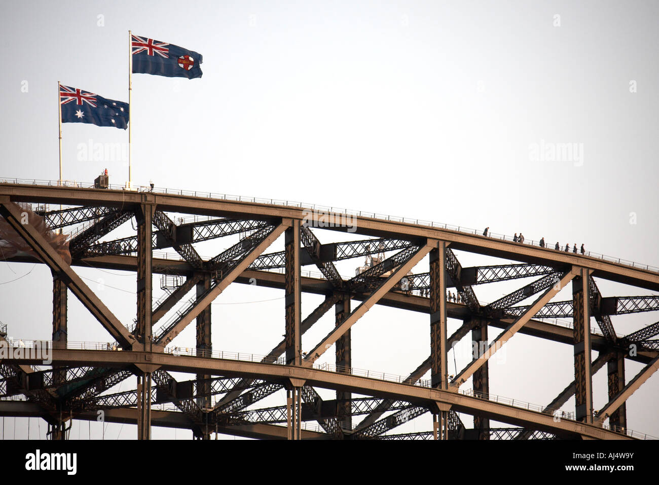 Australian flags above Harbour Bridge with walkers in Sydney New South Wales NSW Australia Stock Photo