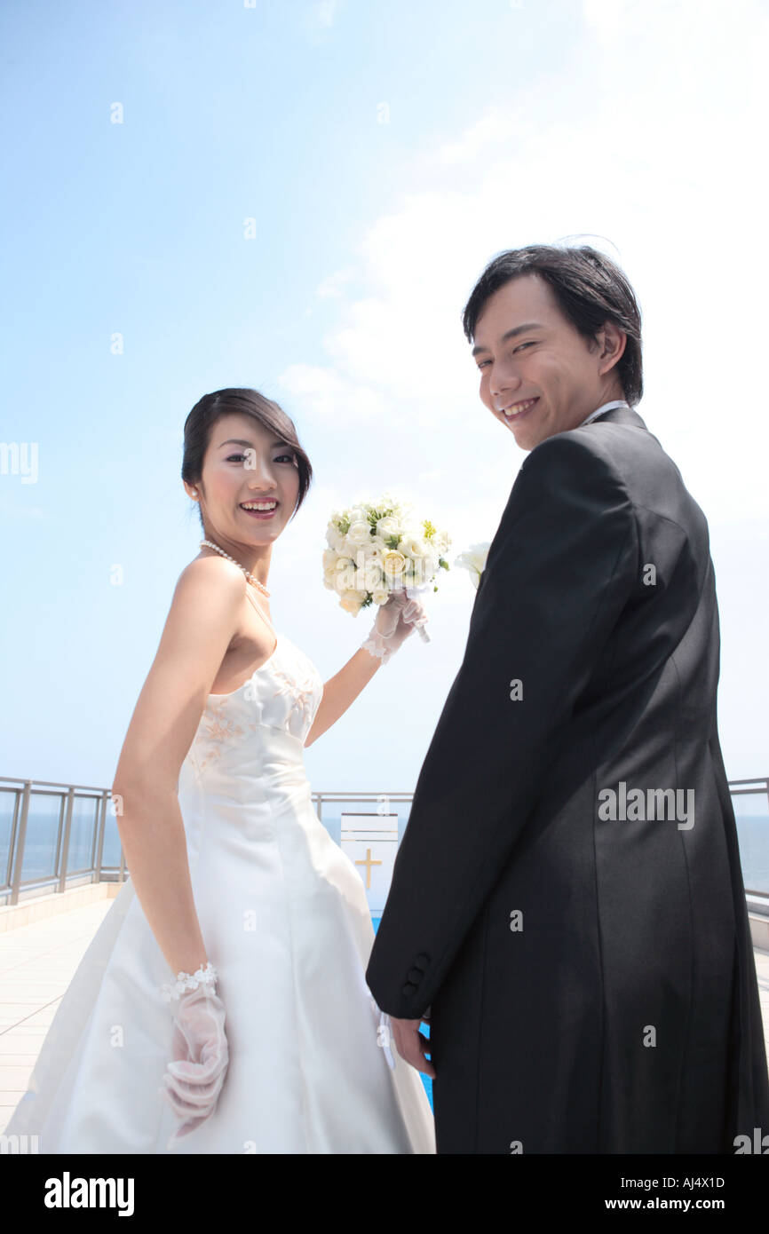 Bride and groom looking at camera Stock Photo
