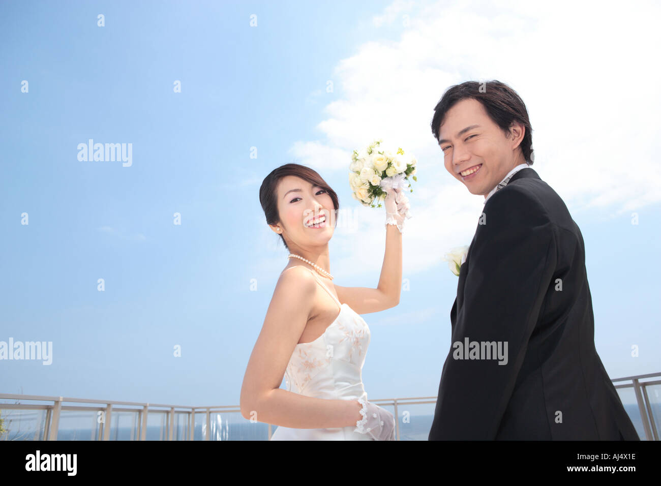 Bride and groom looking at camera Stock Photo