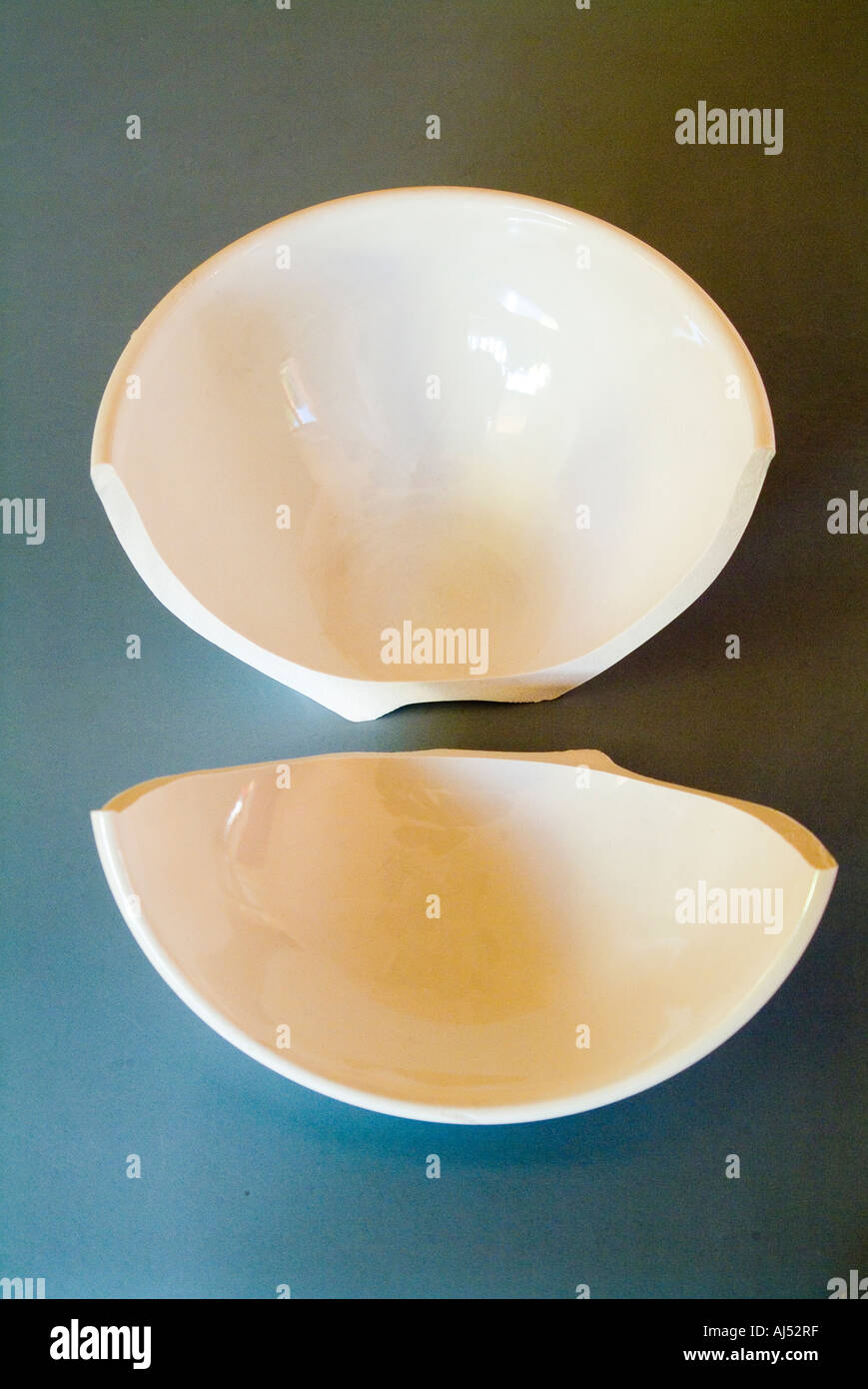 A broken china bowl Stock Photo Alamy