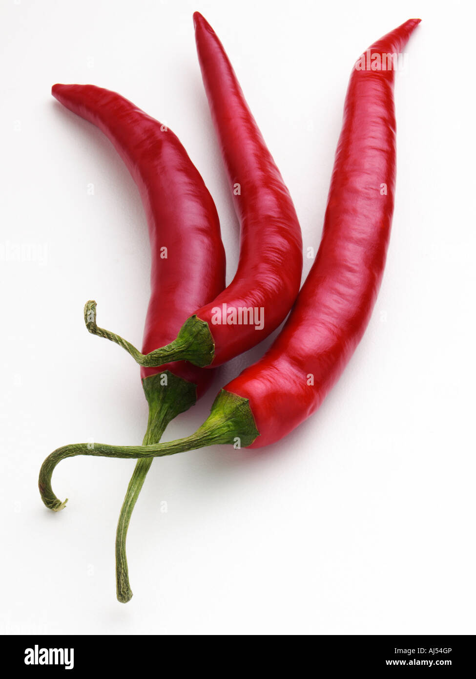 Red chilli peppers on a white background Stock Photo - Alamy