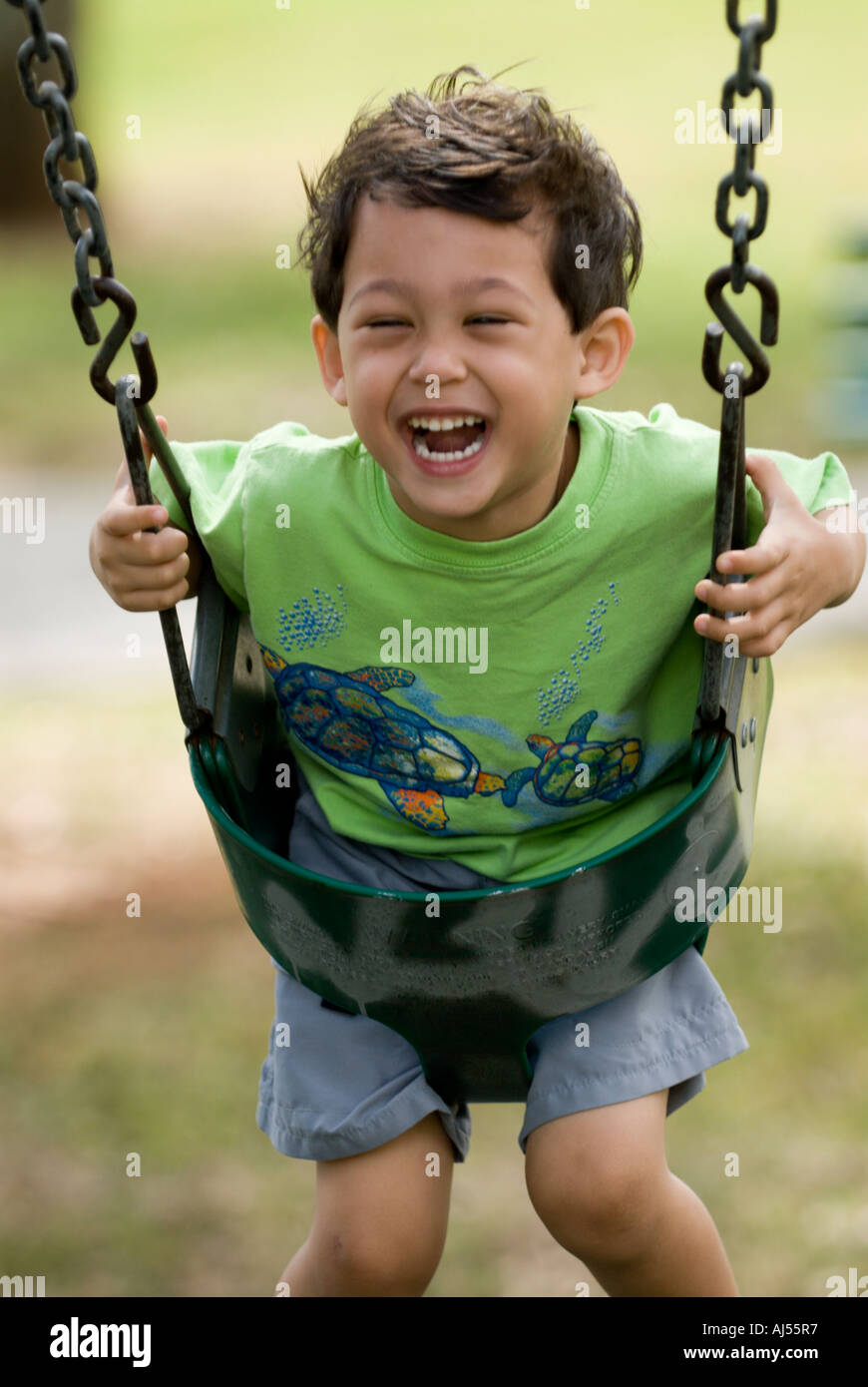 3 Year Old Filipino Caucasian Boy On Swing Stock Photo