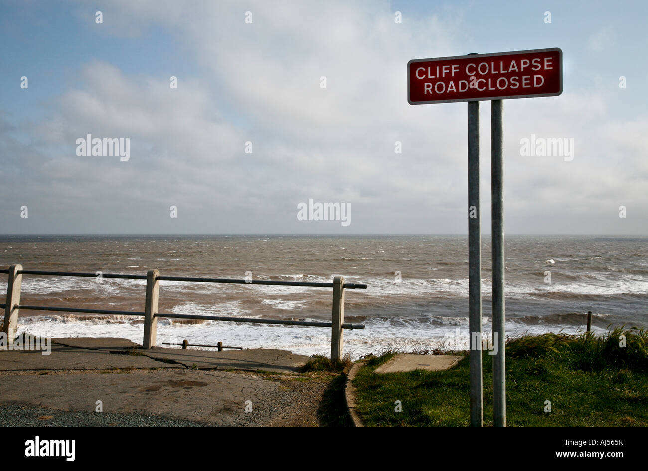 Seaside Road barrier and sign in Aldbrough, Yorkshire, UK. Erosion along the North Sea coastline. Stock Photo