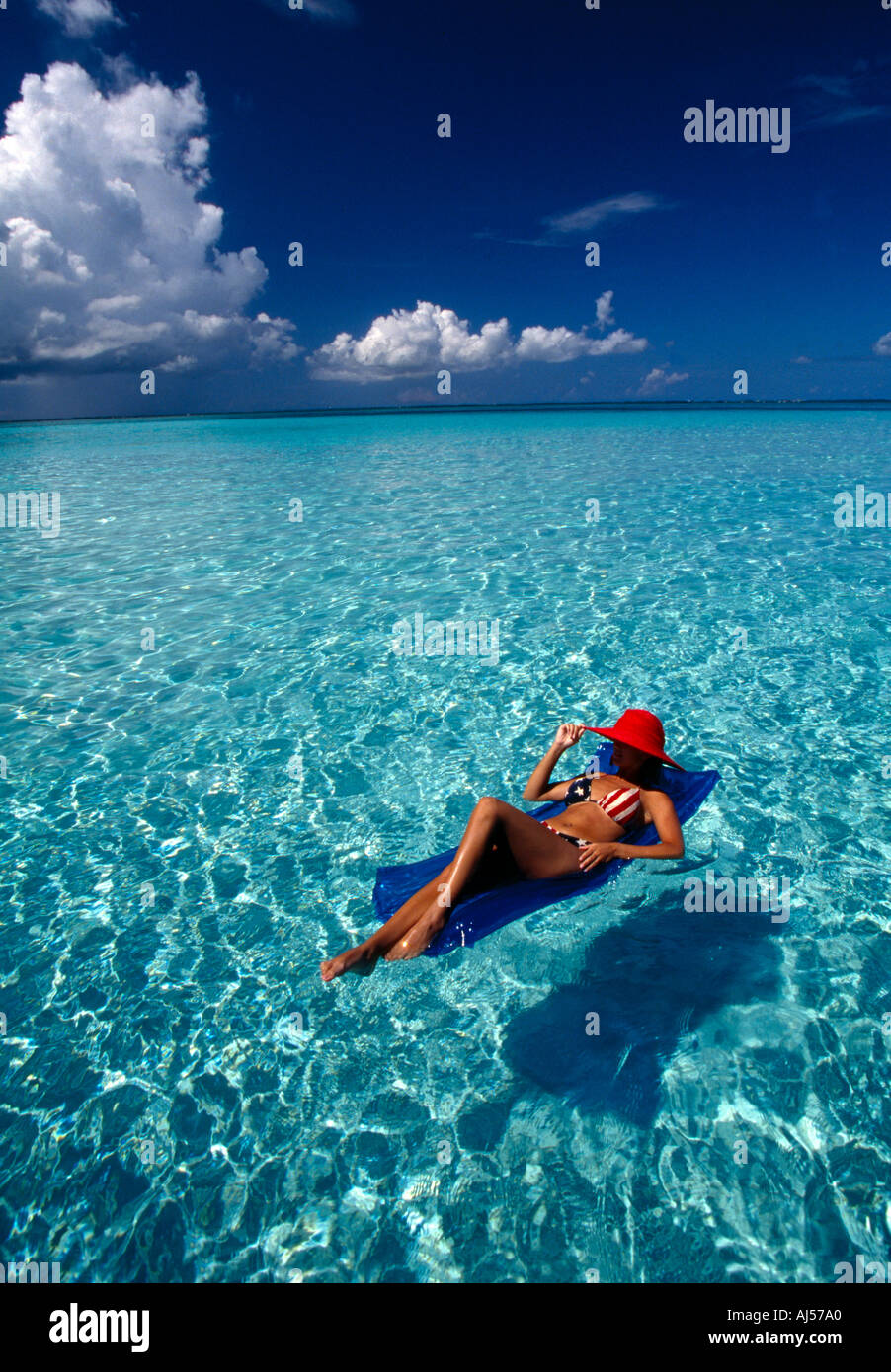 Woman in red bikini wearing hi-res stock photography and images - Alamy