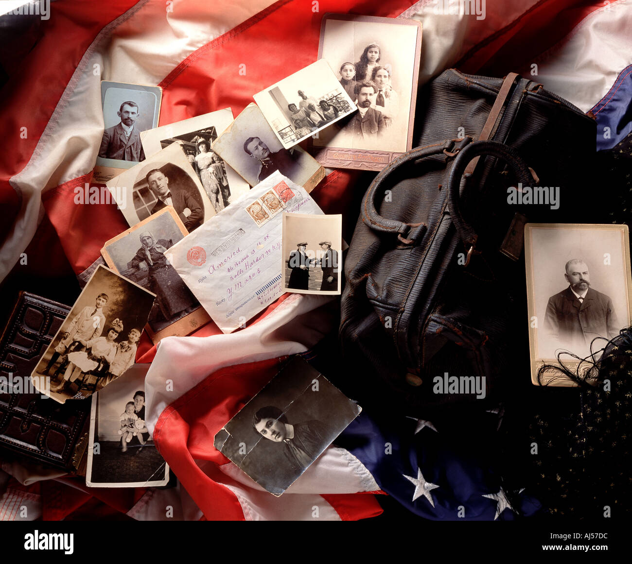 Still life of Immigrant family mementos Against an American flag background Stock Photo