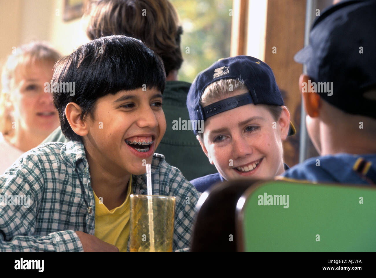 Teenage boys hanging out in diner Stock Photo - Alamy