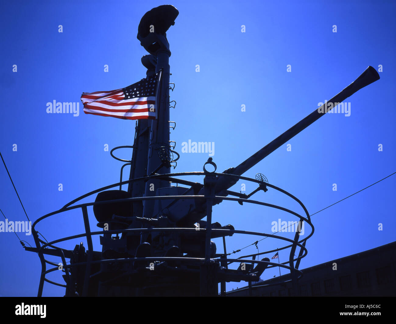 The cannon and conning tower of the USS Pampanito the WWII American submarine now moored in San Francisco Stock Photo