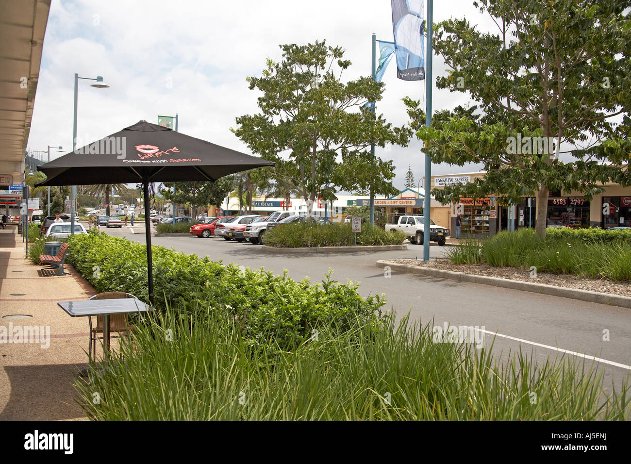 Shops and buildings with green avenue of town centre in Port Macquarie New  South Wales NSW Australia Stock Photo - Alamy