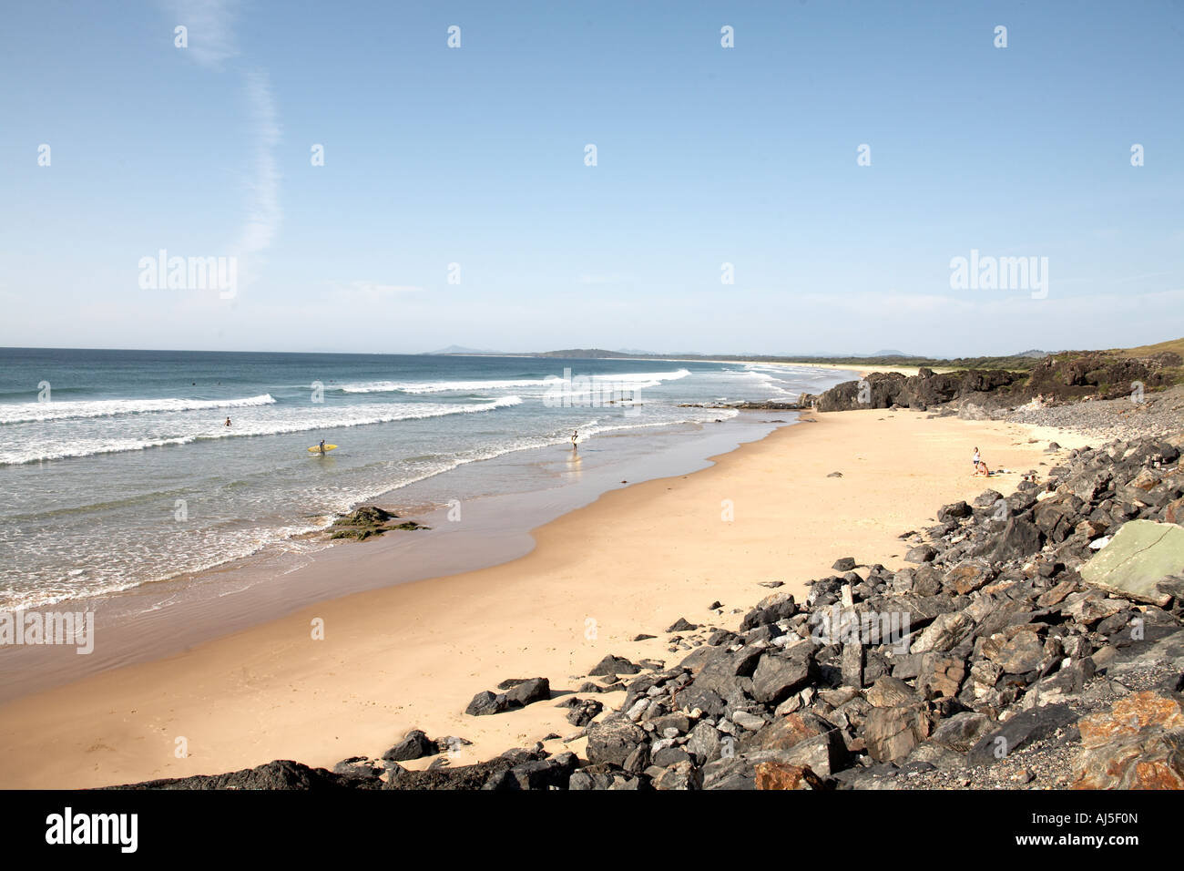 Sea and sandy Boambee Beach in early morning with people at Coffs Harbour in New South Wales NSW Australia Stock Photo