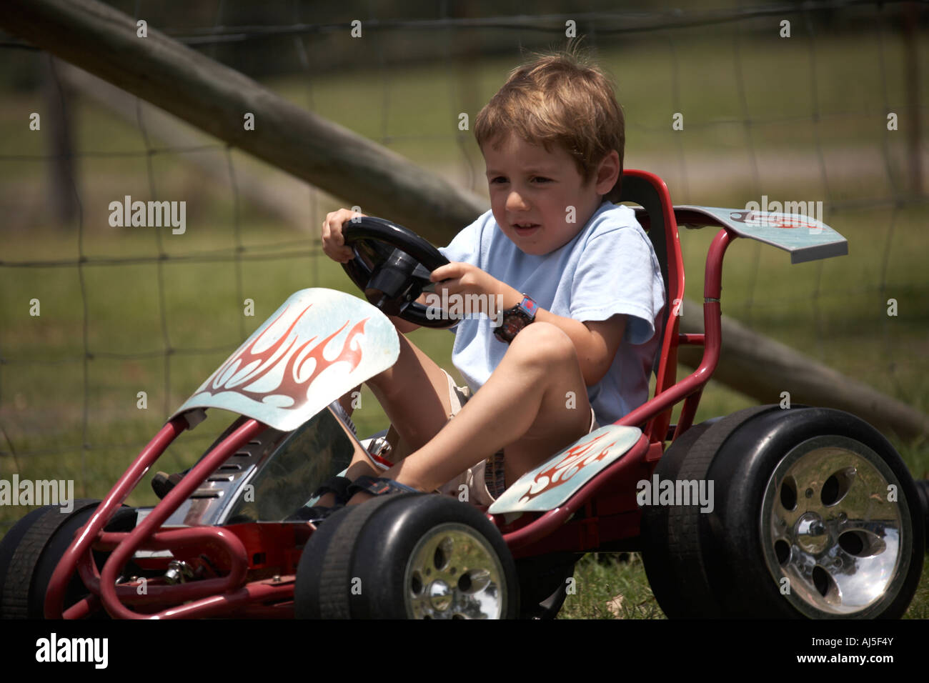 Young boy child driving Go Kart outdoors in Coffs Harbour in New South Wales NSW Australia CJWH Stock Photo
